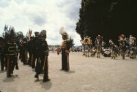 Saints Day, groups of band members and men in large headdresses, 1982