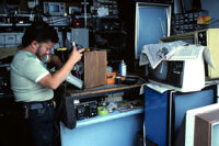 Oaxaca, man fixing television, 1982 or 1985