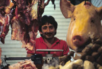 Oaxaca, butcher and pig head, 1982 or 1985