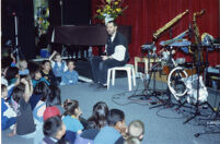 Tom Guralnick and school kids, 1997 [descriptive]