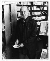 Lawrence Ferlinghetti in a book store (City Lights?), 1978 [descriptive]