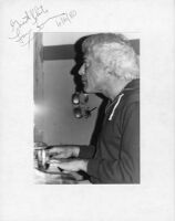 Autographed photo of Lou Levy playing piano, 1979 [descriptive]