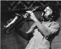 John Gruntfest playing saxophone, 1978 [descriptive]