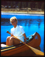 Jo Ann Smith paddling in canoe, circa 1936-1945