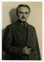 Richard J. Neutra, portrait, striped suit and pipe in hand, circa 1940