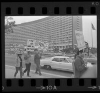 Protesters on Avenue of the Stars during President Johnson's visit to the Century Plaza Hotel. 1967.