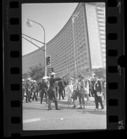 Police block pedestrians during President Johnson's visit at Century Plaza, 1967