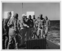 "The Frogmen," Dana Andrews at left, Richard Widmark (2nd from right), Director Lloyd Bacon (pointing)