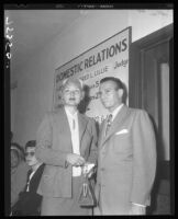 Barbara Payton with Attorney Milton Golden at Los Angeles Court House during proceedings for her divorce from Franchot Tone, Los Angele, 1952