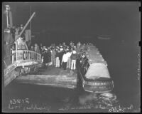 Crowd at Santa Monica Pier boards ferry, Irene, for a gambling barge on the ocean, 1939.