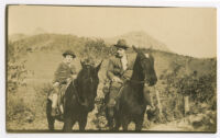 Bob Brown [?] and boy riding horses [photograph]