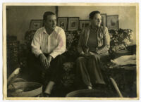 Bob and Rose Brown seated on a couch [photograph]