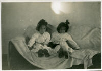 Two little girls on couch