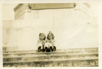 Two little girls sitting on a staircase