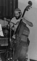 Roberto Miranda playing double bass, 1977 [descriptive]