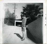 Woman posing on driveway
