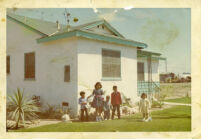 Children in front of house