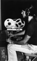 Recording engineer Bruce Bidlack with sound equipment, late 1970s [descriptive]