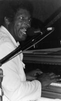 Blues musician Charles Brown playing piano, 1977 [descriptive]