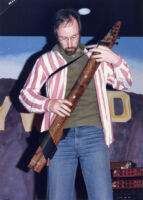 Emmett Chapman playing "the stick" in Pomona California, 1984 [descriptive]