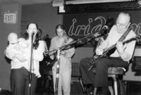 Les Paul, Susan Tedeschi and unidentified musicians at the Iridium Jazz Club in New York City, circa 2002 [descriptive]