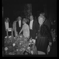 Otis Chandler (center) with wife Marilyn Brant (left) mother Dorothy Buffum Chandler and sons at the Las Madrinas Ball, 1973.