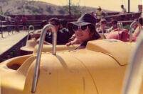 Woman in boat ride at amusement park
