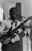Johnny Fuller playing guitar at the San Francisco Blues Festival, 1977 [descriptive]