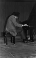 Elliott Schwartz playing piano in San Francisco, 1979 [descriptive]