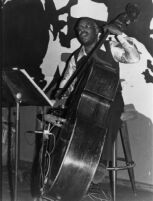 Andy Simpkins playing double bass, 1979 [descriptive]