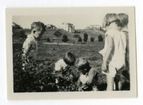 Children playing in plants, 1930-1931.