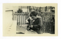 Girl pounding a nail, 1933-1934.