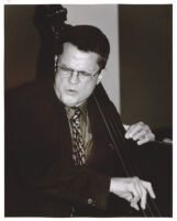 Charlie Haden playing the double bass, Los Angeles [descriptive]