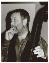 Dave Holland playing the double bass in Los Angeles [descriptive]