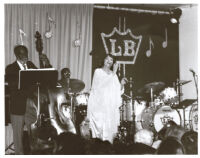 Ruth Price singing on stage, Los Angeles [descriptive]
