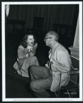 Betty Hutton talks to director Mitchell Leisen on the set of Dream Girl