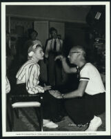 Betty Hutton and director Mitchell Leisen talking between scenes on the set of Dream Girl