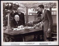 Lionel Barrymore, Frank Hagney, and James Stewart in It's a Wonderful Life
