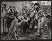 Bob Hope dressed as a Native American with other unidentified cast members in The Paleface