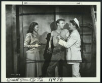 Marguerite Chapman, Harry Lauter and John Archer in a scene from Sea Tiger