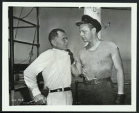 Harry Lauter and an unidentified actor in a scene from Sea Tiger