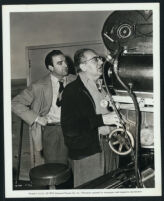 Producer-director, Fritz Lang, and cinematographer, Stanley Cortez, between scenes on Secret Beyond The Door