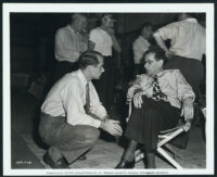 Director George S. Kaufman and Gene Fowler, Jr., on the sets of The Senator Was Indiscreet