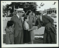 Joseph Cotten, Teresa Wright, Henry Travers and child actors in a scene from Shadow of a Doubt