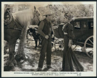 Johnny Mack Brown and Jan Bryant in a scene from Shadows on the Range