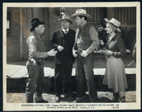 Johnny Mack Brown, Raymond Hatton, Jan Bryant and unidentified actor in a scene from Shadows on the Range