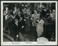 Danny Kaye surrounded by musicians in a scene from A Song is Born
