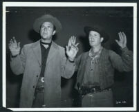 Dick Powell and Regis Toomey in Station West