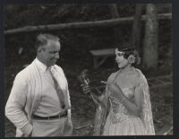 Director Allan Dwan with Renee Adoree on the set of Tide Of Empire