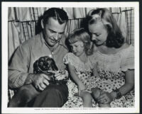 Brian Donlevy with his family in a publicity photo for The Trouble With Women
